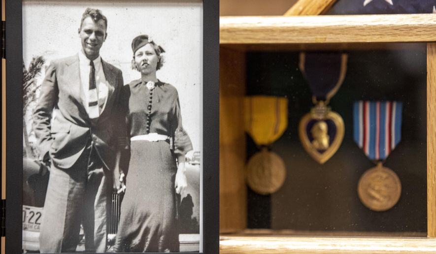 A photograph of Lt. j.g. William Ennis Spencer, Jr. with his wife Ester from the 1930s sits next to his medals at the American Legion Post in Goose Creek, S.C. on Friday, Nov. 6, 2020.   Nearly 2 million Purple Hearts have been awarded to brave Americans who have been wounded or killed in the line of duty, and it is one of the highest honors that can be bestowed to veterans. (Andrew J. Whitaker/The Post And Courier via AP)