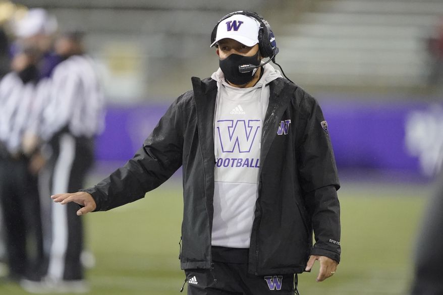 Washington coach Jimmy Lake gestures from the sideline during the first half of the team's NCAA college football game against Oregon State, Saturday, Nov. 14, 2020, in Seattle. (AP Photo/Ted S. Warren)