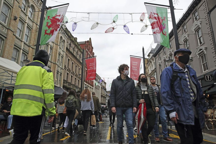 A view of a a busy street on the first weekend after Wales&#39; 17-day fire-break lockdown to curb the spread of coronavirus, in Cardiff, Saturday, Nov. 14, 2020. (Nick Potts/PA via AP)