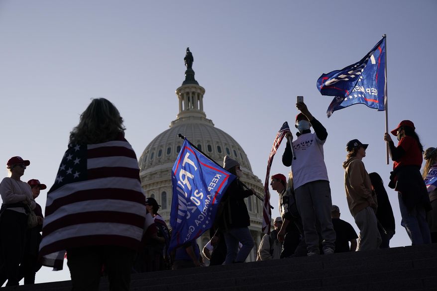 With the U.S. Capitol building in the background, supporters of President Donald Trump attend a pro-Trump march Saturday Nov. 14, 2020, in Washington, in this file photo. (AP Photo/Jacquelyn Martin) **FILE**