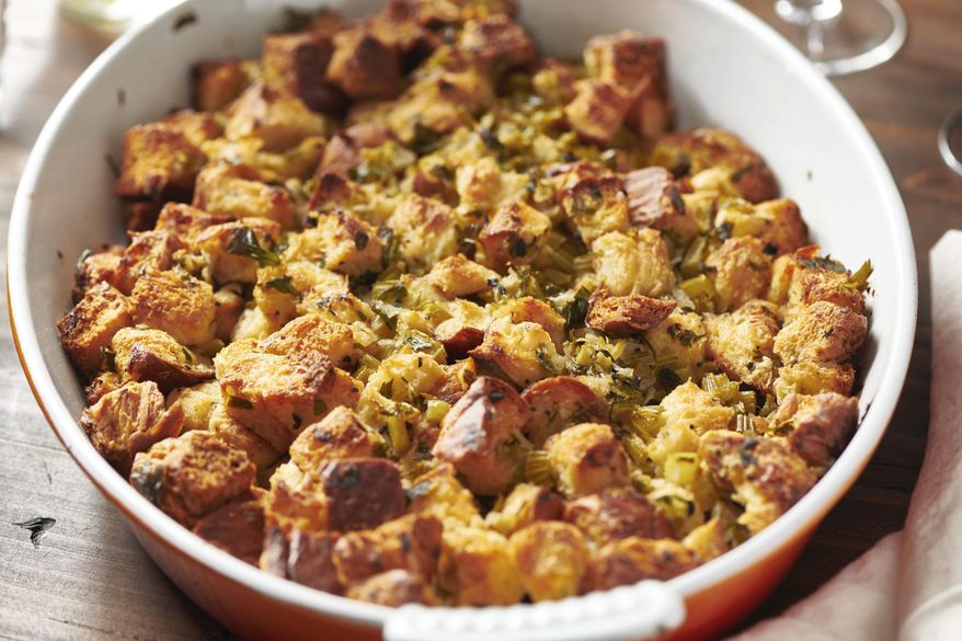 This August 2020 photo shows a recipe for traditional Thanksgiving stuffing in New York. The recipe can be cut in half and baked in a smaller pan for less time for a smaller group. (Katie Workman via AP)