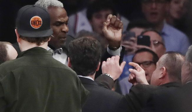 FILE - In this Feb. 8, 2017 file photo, former New York Knicks player Charles Oakley exchanges words with a security guard during the first half of an NBA basketball game between the New York Knicks and the LA Clippers, in New York&#x27;s Madison Square Garden. A jury can decide whether former New York Knicks star  Oakley was ejected from Madison Square Garden with excessive force when he was removed as a spectator to a 2017 game, an appeals court ruled Monday. (AP Photo/Frank Franklin II, File)
