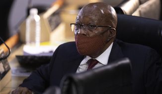 Former South African President Jacob Zuma appears at the hearing for his application for Deputy Chief Justice Raymond Zondo, to recuse himself from the state capture commission inquiry in Johannesburg, South Africa, Monday, Nov. 16, 2020. (AP Photo/Themba Hadebe)