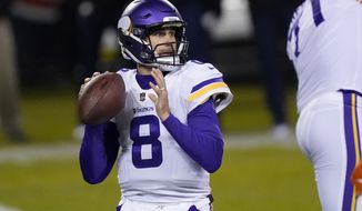 Minnesota Vikings quarterback Kirk Cousins throws during the first half of an NFL football game against the Chicago Bears Monday, Nov. 16, 2020, in Chicago. (AP Photo/Charles Rex Arbogast)