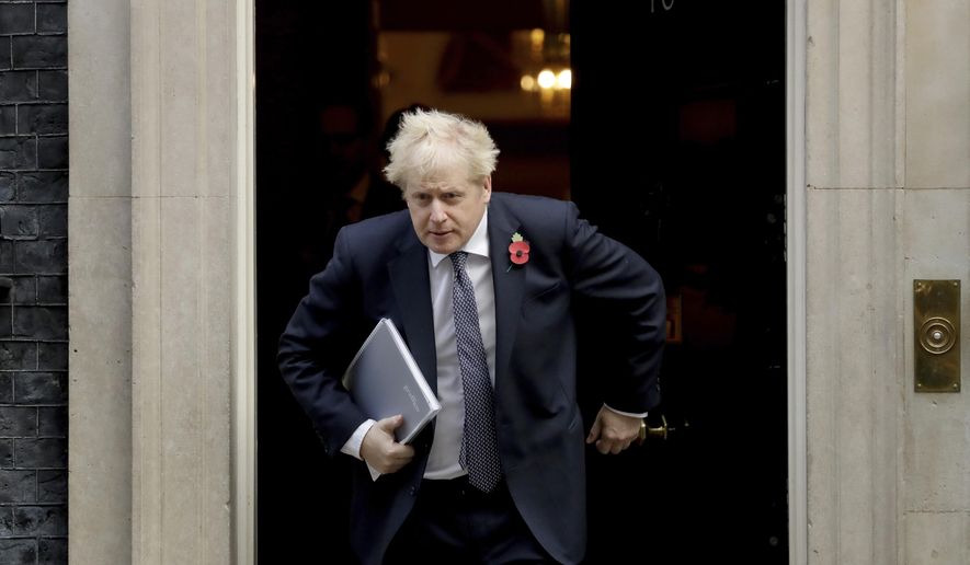 FILE - In this Nov. 10, 2020 file photo British Prime Minister Boris Johnson leaves 10 Downing Street in London. Johnson is self-isolating after being told he came into contact with someone who tested positive for the coronavirus, officials said Sunday Nov. 15. &amp;quot;He will carry on working from Downing Street, including on leading the government&#39;s response to the coronavirus pandemic,&amp;quot; a statement from his office said. (AP Photo/Matt Dunham, File)
