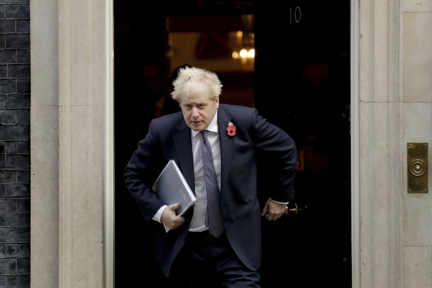 FILE - In this Nov. 10, 2020 file photo British Prime Minister Boris Johnson leaves 10 Downing Street in London. Johnson is self-isolating after being told he came into contact with someone who tested positive for the coronavirus, officials said Sunday Nov. 15. &amp;quot;He will carry on working from Downing Street, including on leading the government&#39;s response to the coronavirus pandemic,&amp;quot; a statement from his office said. (AP Photo/Matt Dunham, File)