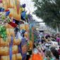 Float riders toss beads and trinkets during the Krewe of Thoth Mardi Gras parade in New Orleans.  (AP Photo/Gerald Herbert, File)