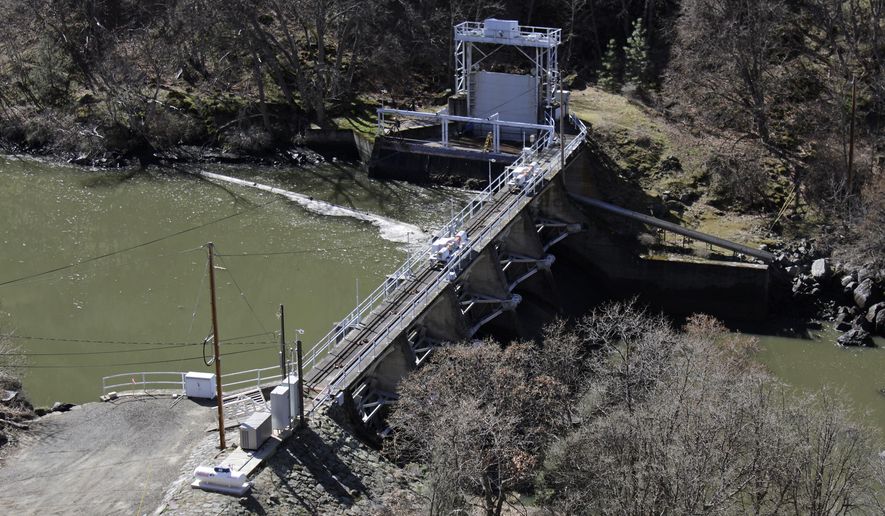 FILE - In this March 3, 2020, file photo, a dam on the Lower Klamath River known as Copco 2 is seen near Hornbrook, Calif. A new agreement announced Tuesday, Nov. 17, 2020, promises to revive faltering plans to demolish four massive hydroelectric dams on a river along the Oregon-California border to save imperiled salmon by emptying giant reservoirs and reopening hundreds of miles of potential fish habitat that&#39;s been blocked for more than a century. (AP Photo/Gillian Flaccus, File)