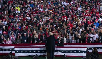 FILE - In this Oct. 24, 2020, file photo, President Donald Trump speaks during a campaign rally in Circleville, Ohio. Trump’s 2020 reelection campaign was powered by a cell phone app that allowed staff to monitor the movements of his millions of supporters, and offered intimate access to their social networks. The app lets Trump’s team communicate directly with the 2.8 million people who downloaded it and if they gave permission, with their entire contact list as well. (AP Photo/Evan Vucci, File)