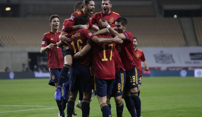 Spain&#x27;s players celebrate a goal against Germany during the UEFA Nations League soccer match between Spain and Germany in Seville, Spain, Tuesday, Nov. 17, 2020. (AP Photo/Miguel Morenatti)