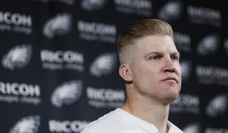 FILE - In this Jan. 5, 2020, file photo, Philadelphia Eagles&#39; Josh McCown speaks during a news conference after an NFL wild-card playoff football game in Philadelphia. In 2002 the Houston Texans were an expansion team preparing for their first season and McCown had just wrapped up his college career at nearby Sam Houston State. Nineteen seasons and nine teams later the quarterback finally got his wish when he signed with the Texans this month to be their third quarterback behind Deshaun Watson and AJ McCarron. (AP Photo/Michael Perez, File)