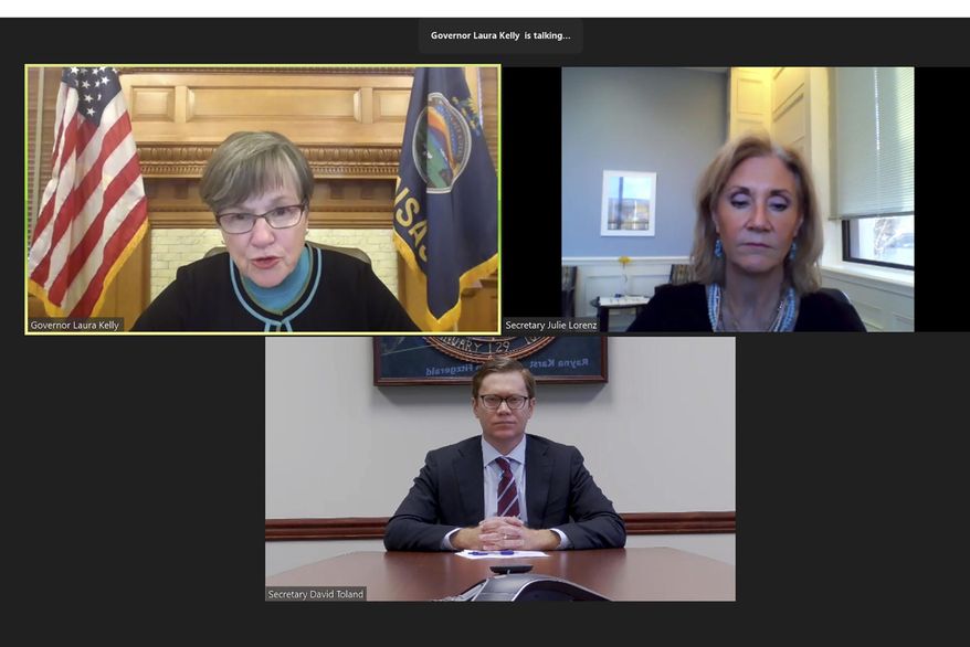 In this computer screen capture from a Zoom news conference, Kansas Gov. Laura Kelly, upper left, discusses grants to small businesses hurt by the coronavirus pandemic as Julie Lorenz, upper right, the director of the state's pandemic recovery office, and David Toland, Kansas commerce secretary, watch, Monday, Nov. 16, 2020, in Topeka, Kan. State officials say Kansas can't help at least half of the small businesses seeking grants because of limited federal coronavirus relief funds. (AP Photo/John Hanna)