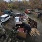 Ethnic Armenians load a truck as they prepare to leave their home in the village of Maraga, in the Martakert area, in the separatist region of Nagorno-Karabakh, Wednesday, Nov. 18, 2020. A Russia-brokered cease-fire to halt six weeks of fighting over Nagorno-Karabakh stipulated that Armenia turn over control of some areas it holds outside the separatist territory&#x27;s borders to Azerbaijan. Armenians are forced to leave their homes before the region is handed over to control by Azerbaijani forces. (AP Photo/Sergei Grits)