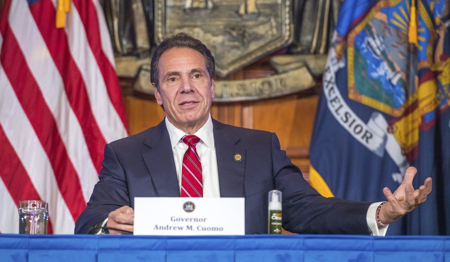 In this Wednesday, Nov. 18, 2020 photo provided by the Office of Governor Andrew M. Cuomo, Gov. Cuomo holds a press briefing on the coronavirus in the Red Room at the State Capitol in Albany, N.Y. During the news conference, Cuomo predicted a &quot;tremendous spike&quot; in COVID-19 cases after Thanksgiving as he pleaded with people not to be lulled into a false sense of safety over the holiday. (Darren McGee/Office of Governor Andrew M. Cuomo via AP)