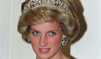 FILE - In this file photo dated Nov. 7, 1985, Britain&#x27;s Princess Diana wears the Spencer tiara as she and Prince Charles attend state dinner at Government House in Adelaide, Austraila.  The BBC’s board of directors has announced Wednesday Nov. 18, 2020, the appointment of a retired senior judge to lead an independent investigation into the circumstances around a controversial 1995 TV interview with Princess Diana.  (AP Photo/Jim Bourdier, FILE)