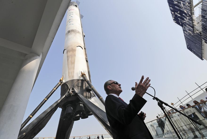 U.S. Ambassador John Rakolta talks in front of replica of the SpaceX Falcon 9, during the U.S.A Pavilion handover ceremony at the Dubai Expo 2020, United Arab Emirates, Wednesday, Nov. 18, 2020. The U.S. showed off a literally star-studded pavilion Wednesday for Dubai&#39;s upcoming Expo 2020, complete with a replica SpaceX rocket body beside it. (AP Photo/Kamran Jebreili)