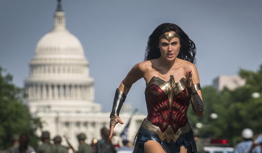 This image released by Warner Bros. Pictures shows Gal Gadot as Wonder Woman in a scene from &amp;quot;Wonder Woman 1984.&amp;quot; The film isn&#x27;t skipping theaters or moving to 2021, but it is altering course. The last big blockbuster holdout of 2020 is still opening in U.S. theaters on Christmas Day but it will also be made available to HBO Max subscribers free of charge for its first month, Warner Bros. said Wednesday, Nov. 18, 2020. (Clay Enos/Warner Bros Pictures via AP)