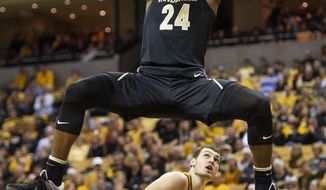 FILE - Vanderbilt&#39;s Aaron Nesmith (24) dunks the ball over Missouri&#39;s Reed Nikko, bottom, during the first half of an NCAA college basketball game in Columbia, Mo., in this Saturday, Feb. 2, 2019, file photo. Nesmith is a possible pick in the NBA Draft, Wednesday, Nov. 18, 2020. (AP Photo/L.G. Patterson, File)