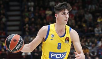FILE - In this Nov. 19, 2019, file photo, Maccabi Fox Tel Aviv&#39;s Deni Avdija controls the ball during the Euro League basketball match between Olimpia Milan and Maccabi Fox Tel Aviv, in Milan, Italy. Avdija was selected by the Washington Wizards in the NBA draft Wednesday, Nov. 18, 2020. (AP Photo/Antonio Calanni, File)