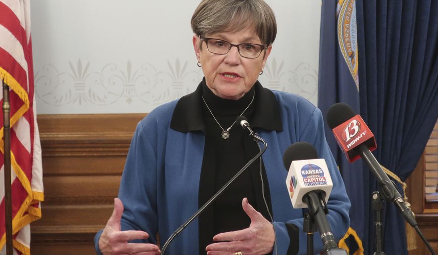 Kansas Gov. Laura Kelly answers questions about the state&#39;s response to the coronavirus pandemic during a news conference, Wednesday, Nov. 18, 2020, at the Statehouse in Topeka, Kan. Kelly has imposed a new mask mandate for counties that don&#39;t already have one, though state law allows them to opt out. (AP Photo/John Hanna)