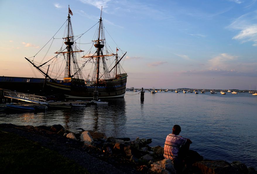 The Mayflower II, a replica of the original Mayflower ship that brought the Pilgrims to America 400 year ago, is docked in Plymouth, Mass., days after returning home following extensive renovations, Wednesday, Aug. 12, 2020. A disease outbreak that wiped out large numbers of the Native inhabitants of what is now New England gave the Pilgrims a beachhead in the "New World." So, some historians find it ironic that a pandemic has put many of the 400th anniversary commemorations of the Mayflower's landing on hold. (AP Photo/David Goldman)