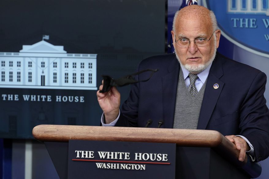 Centers for Disease Control and Prevention Director Dr. Robert Redfield holds a face mask as he speaks during a news conference with the coronavirus task force at the White House in Washington, Thursday, Nov. 19, 2020. (AP Photo/Susan Walsh)