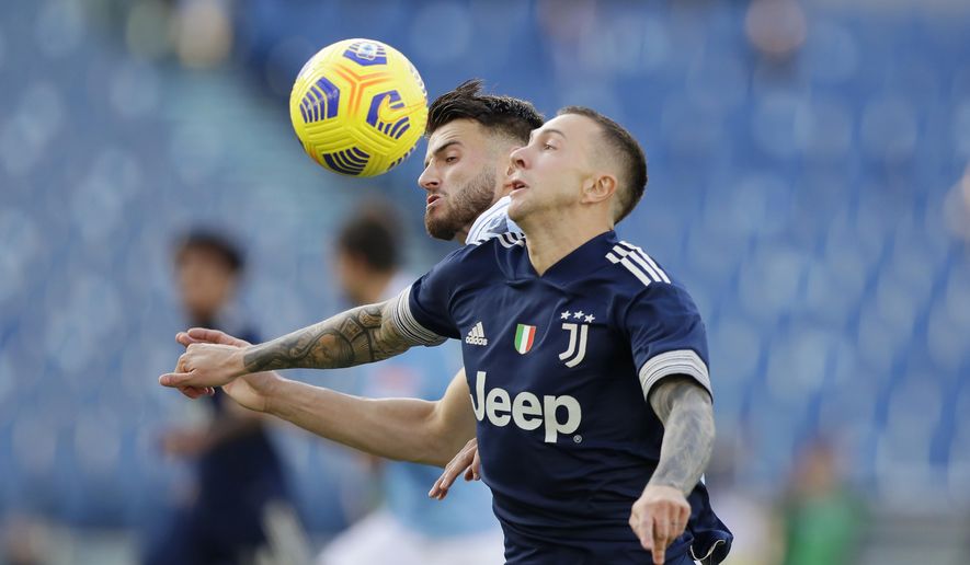 Juventus' Federico Bernardeschi, right, challenges for the ball with Lazio's Wesley Hoedt during the Serie A soccer match between Lazio and Juventus at the Olympic stadium in Rome, Sunday, Nov. 8, 2020. (AP Photo/Andrew Medichini)