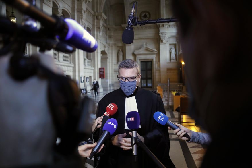French lawyer Thibault de Montbrial, who is representing US soldiers who foiled a terror attack on an Amsterdam-Paris train in 2015, speaks to media on the opening day of the Thalys attack trial, at the Paris courthouse, Monday, Nov. 16, 2020. Islamic State operative Ayoub El Khazzani goes on trial Monday Nov. 16, 2020, in France on terror charges for appearing on a train with an arsenal of weapons and shooting one passenger in 2015. (AP Photo/Thibault Camus)
