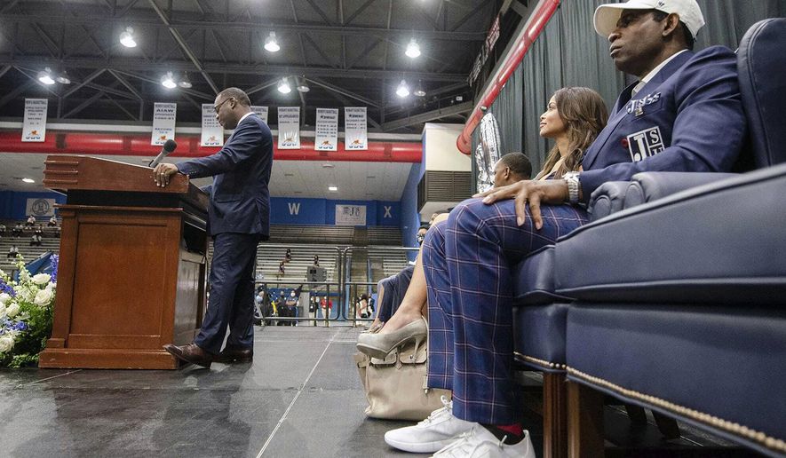 Jackson State University interim president Thomas Hudson, left, speaks during the introductory press conference for Deion Sanders, right, where he was named the head coach of the Jackson State NCAA college football team, Monday, Sept. 21, 2020, in Jackson, Miss. (Eric Shelton/The Clarion-Ledger via AP)