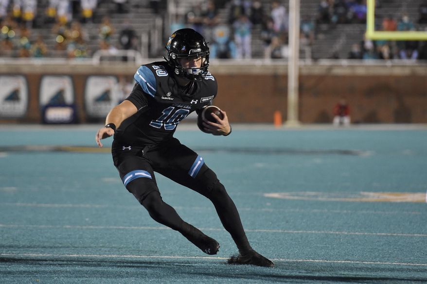 Coastal Carolina quarterback Grayson McCall scrambles out of the pocket during the first half of an NCAA college football game against South Alabama, Saturday, Nov. 7, 2020, in Conway, S.C. (AP Photo/Richard Shiro)