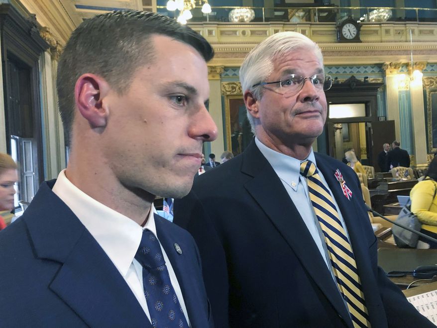 FILE - In this May 24, 2019 file photo, Republican House Speaker Lee Chatfield, left, and Republican Senate Majority Leader Mike Shirkey speak with reporters at the Capitol in Lansing, Mich. Chatfield and Shirkey are headed to the White House on Friday as President Donald Trump made an extraordinary and sure-to-be futile attempt to block Joe Biden's victory in the battleground state and subvert the results of the 2020 presidential election. (AP Photo/David Eggert, File)