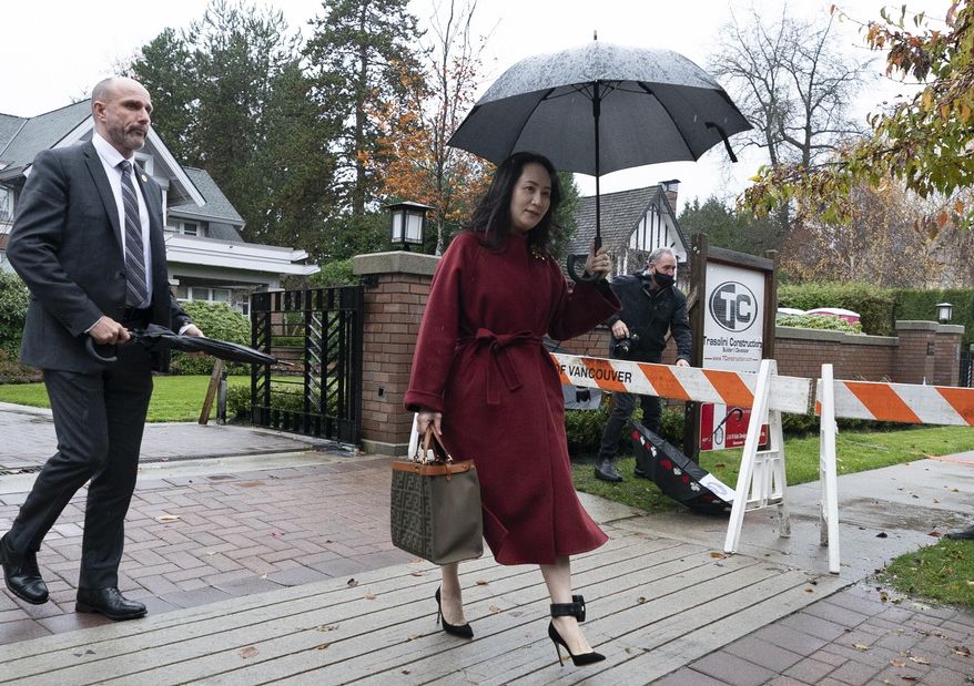 Meng Wanzhou, chief financial officer of Huawei, leaves her home in Vancouver, British Columbia Wednesday, Nov. 18, 2020, to attend an evidentiary hearing in her extradition case at B.C. Supreme Court. (Jonathan Hayward/The Canadian Press via AP)