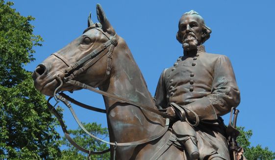 In this Aug. 18, 2017, file photo, a statue of Confederate Gen. Nathan Bedford Forrest sits in a park in Memphis, Tenn. Lawyers in Tennessee are seeking a judge&#39;s approval for the disinterment of Confederate general and slave trader Nathan Bedford Forrest&#39;s remains from his burial plot in a Memphis park, Friday, Nov. 20, 2020. (AP Photo/Adrian Sainz, File)
