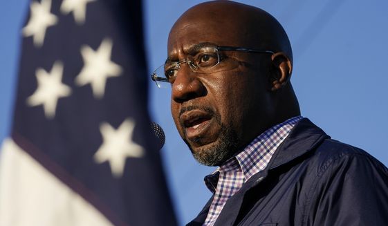Raphael Warnock, a Democratic candidate for the U.S. Senate, speaks during a campaign rally on Sunday, Nov. 15, 2020, in Marietta, Ga. Warnock and U.S. Sen. Kelly Loeffler are in a runoff election for the Senate seat. (AP Photo/Brynn Anderson)