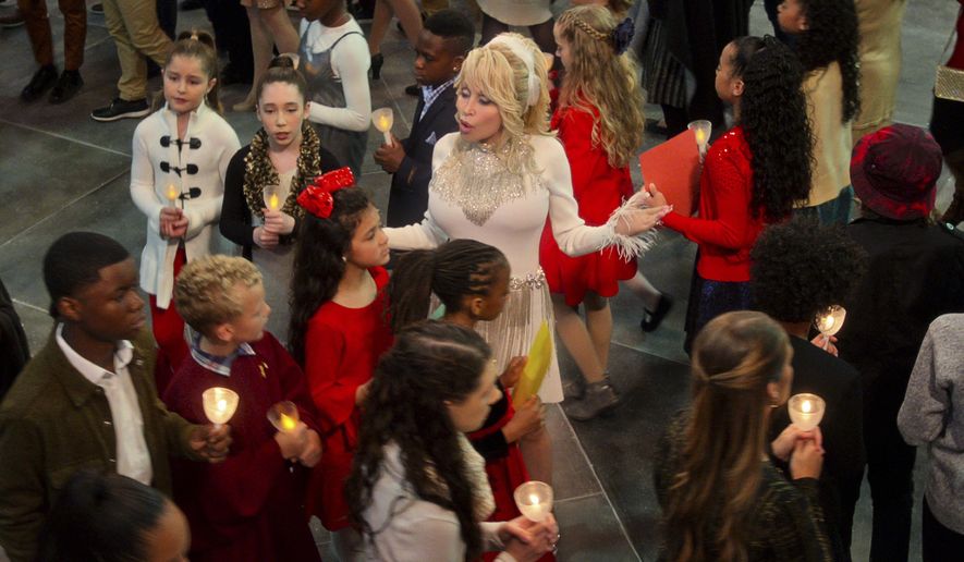 This image released by Netflix shows Dolly Parton in a scene from "Dolly Parton’s Christmas on the Square." (Netflix via AP)