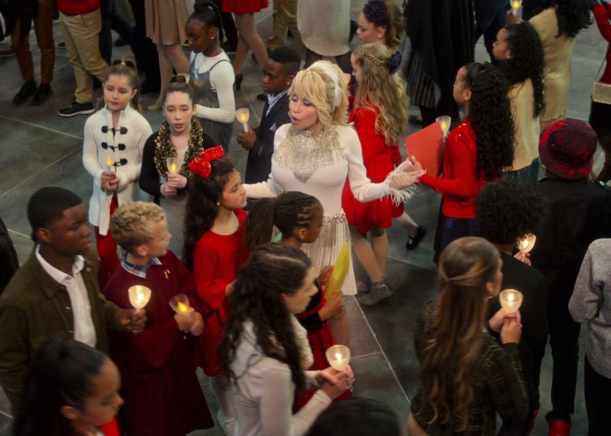 This image released by Netflix shows Dolly Parton in a scene from "Dolly Parton’s Christmas on the Square." (Netflix via AP)