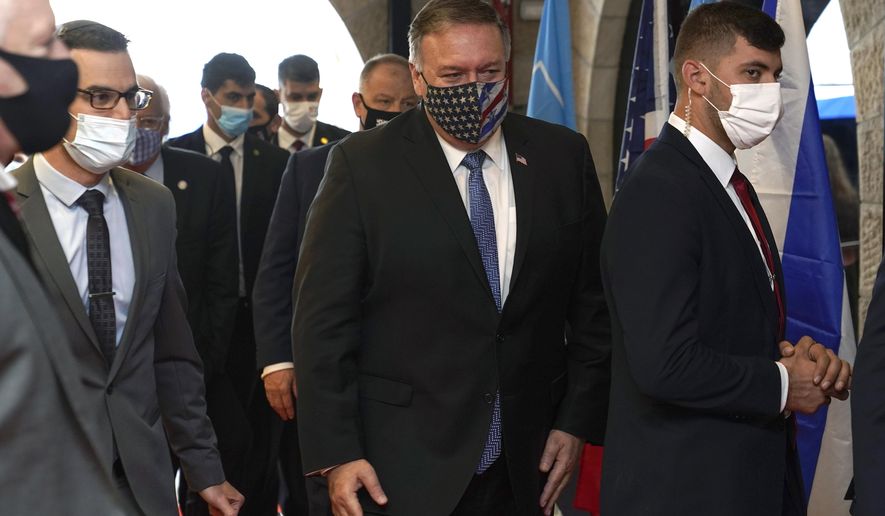 U.S. Secretary of State Mike Pompeo, center, arrives for a tour of the Friends of Zion Museum, Friday, Nov. 20, 2020, in Jerusalem. (AP Photo/Patrick Semansky, Pool)