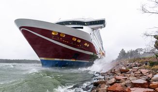 A view of the Viking Line cruise ship Viking Grace, run aground with passengers on board, south of Mariehamn, Finland, Saturday, Nov. 21, 2020. A Baltic Sea ferry with 331 passengers and a crew of 98 has run aground in the Aland Islands archipelago between Finland and Sweden. Finnish authorities say there are “no lives in immediate danger” and the vessel isn&#39;t leaking. The Finnish coast guard tweeted Saturday afternoon that the Viking Line ferry that runs between the Finnish port city of Turku and Swedish capital Stockholm hit ground just off the port of Mariehamn, the capital of the Aland Islands. (Niclas Nordlund/Lehtikuva via AP )
