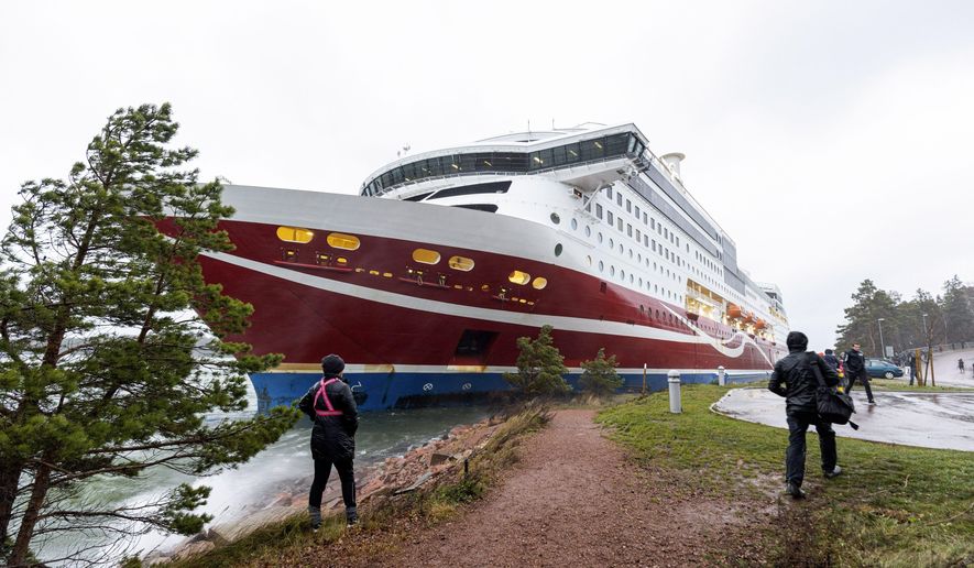 A view of the Viking Line cruise ship Viking Grace, run aground with passengers on board, south of Mariehamn, Finland, Saturday, Nov. 21, 2020. A Baltic Sea ferry with 331 passengers and a crew of 98 has run aground in the Aland Islands archipelago between Finland and Sweden. Finnish authorities say there are “no lives in immediate danger” and the vessel isn&#39;t leaking. The Finnish coast guard tweeted Saturday afternoon that the Viking Line ferry that runs between the Finnish port city of Turku and Swedish capital Stockholm hit ground just off the port of Mariehamn, the capital of the Aland Islands.  (Niclas Nordlund/Lehtikuva via AP)