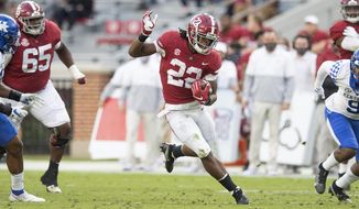 Alabama running back Najee Harris (22) breaks free for a long touchdown run against Kentucky during an NCAA college football game Saturday, Nov. 21, 2020, in Tuscaloosa, Ala. (Mickey Welsh/The Montgomery Advertiser via AP)
