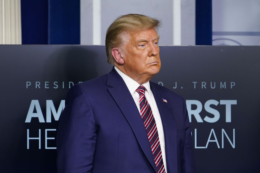 In this Nov. 20, 2020, photo, President Donald Trump listens during a news conference in the briefing room at the White House in Washington. (AP Photo/Susan Walsh) **FILE**