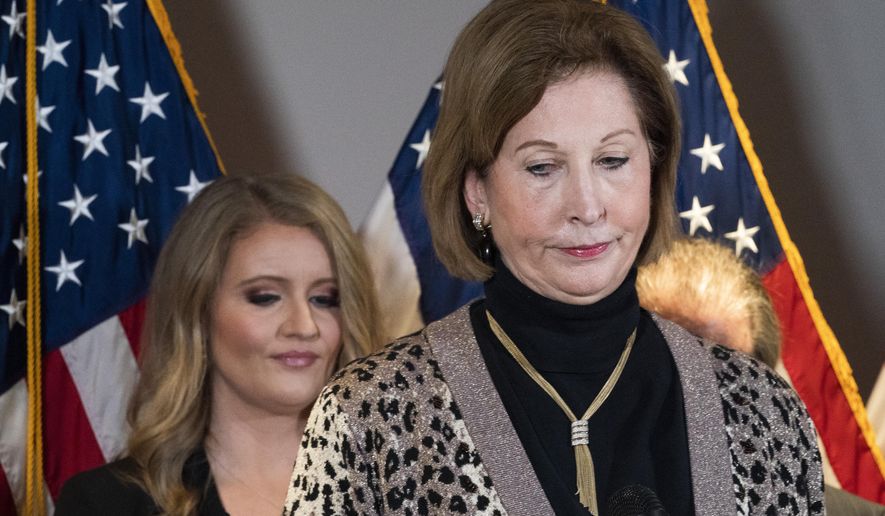 Members of President Donald Trump&#x27;s legal team, Sidney Powell, right, with Jenna Ellis, left, attend a news conference at the Republican National Committee headquarters, Thursday Nov. 19, 2020, in Washington. (AP Photo/Jacquelyn Martin)