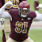 Washington Football Team defensive end Ryan Kerrigan (91) celebrates during an NFL football game against the Cincinnati Bengals, Sunday, Nov. 22, 2020 in Landover, Md. (AP Photo/Daniel Kucin Jr.)