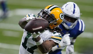 Green Bay Packers wide receiver Davante Adams (17) makes a catch during the first half of an NFL football game against the Indianapolis Colts, Sunday, Nov. 22, 2020, in Indianapolis. (AP Photo/Michael Conroy)