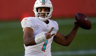 Miami Dolphins quarterback Tua Tagovailoa (1) looks to throw against the Denver Broncos during the first half of an NFL football game, Sunday, Nov. 22, 2020, in Denver. (AP Photo/David Zalubowski)