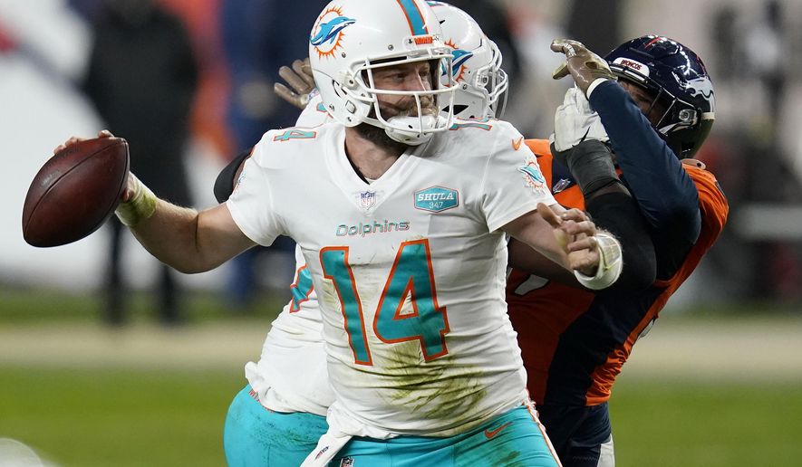 Miami Dolphins quarterback Ryan Fitzpatrick (14) throws against the Denver Broncos during the second half of an NFL football game, Sunday, Nov. 22, 2020, in Denver. The Broncos won 20-13. (AP Photo/David Zalubowski)