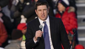 In this Saturday, Oct. 24, 2020, file photo, Rep. Bryan Steil, R-Wisconsin, speaks before President Donald Trump arrives at a campaign rally at the Waukesha County Airport in Waukesha, Wis. Steil said in a statement Sunday, Nov. 22, 2020, that he has tested positive for COVID-19. (AP Photo/Morry Gash, File)