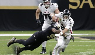 Atlanta Falcons quarterback Matt Ryan (2) is sacked by New Orleans Saints defensive end Cameron Jordan in the second half of an NFL football game in New Orleans, Sunday, Nov. 22, 2020. (AP Photo/Brett Duke)