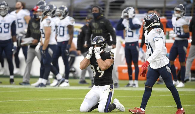 Baltimore Ravens tight end Mark Andrews (89) reacts after failing to catch a pass against Tennessee Titans cornerback Malcolm Butler, right, on a third down play during the second half of an NFL football game, Sunday, Nov. 22, 2020, in Baltimore. The Titans won 30-24 in overtime. (AP Photo/Nick Wass)