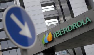 FILE - This Dec. 29, 2012, file photo ,shows the exterior of Spanish energy company Iberdrola is seen, in Madrid, Spain. The parent company of New Mexico’s largest electric utility will become part of energy giant Iberdrola’s global holdings under a multibillion-dollar merger.  Under the agreement announced Wednesday, Oct. 21, 2020, Iberdrola&#39;s majority-owned U.S. subsidiary Avangrid will acquire PNM Resources and its assets in New Mexico and Texas. The merger will require approval from a number of state and federal regulators in a process that&#39;s expected to take the next 12 months. (AP Photo/Andres Kudacki, File)